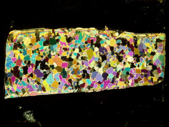 A section of an Antarctic ice core shown under polarized light reveals the individual ice crystals.