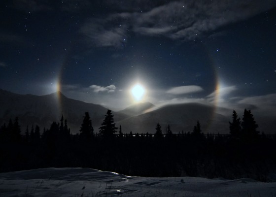 Moonlight illuminates the scene at Lower Miller Creek in Alaska on Jan. 17. Ice crystals in the atmosphere refract the light to create a shining halo with