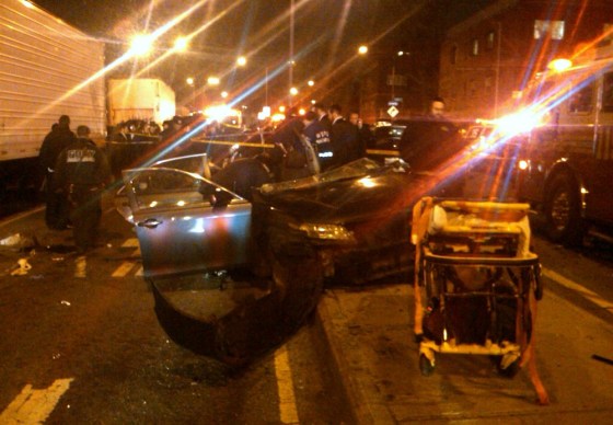 First responders work at the scene shortly after a car accident in Brooklyn, New York, took the lives of an expectant couple Sunday, March 3, 2013.