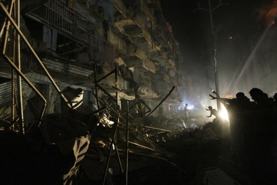 Pakistanis check the site of a bomb blast in Karachi, Pakistan, on Sunday, March 3.