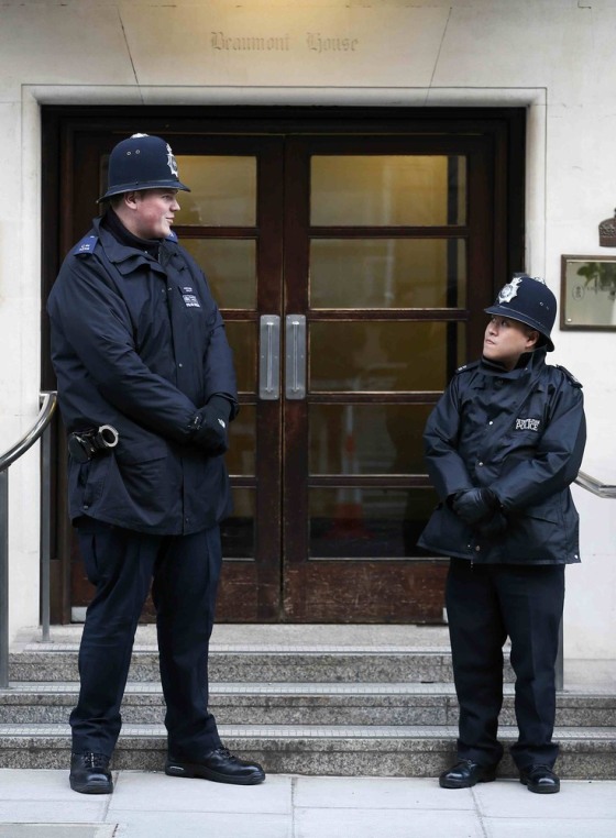 Police officers stand guard outside the King Edward VII Hospital in central London, where Queen Elizabeth was being treated on March 3, 2013.