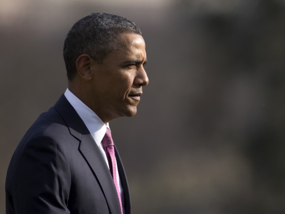 President Barack Obama walks across the South Lawn to the Oval Office of the White House, Tuesday, March 5, 2013, from the Marine One helicopter, as he returned from Walter Reed National Military Medical Center where he visited with Wounded Warriors who are being treated at the hospital and their families.