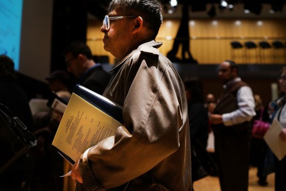 Job seekers wait to speak to representatives of employers at a job fair at the Jewish Community Center in Manhattan on March 6, 2013 in New York City....
