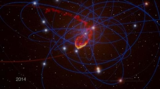 This still photo from a computer animation shows a simulation of a giant space cloud falling into Sagittarius A*, the supermassive black hole at the center of our own Milky Way galaxy, in mid-2013.