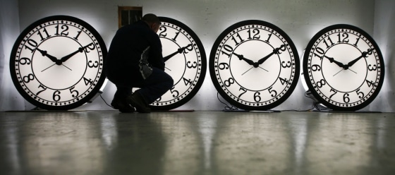 Peter Shugrue checks one of four custom, flush mounted clocks, destined for installation in Kansas City, Mo, at the Electric Time Company factory in Medfield, Mass. on March 8, 2013. Daylight-saving time begins in the United States at 2 a.m. on March 10.