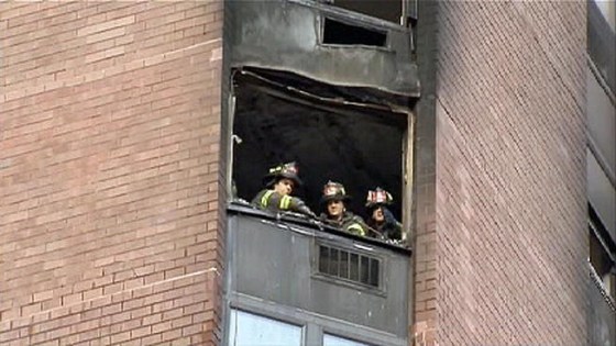 Firefighters at the scene of a fire in a high-rise building in Manhattan