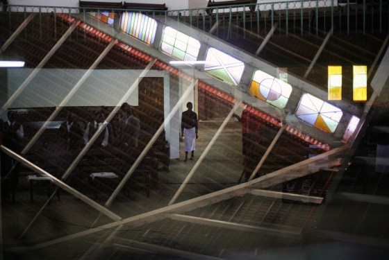 A Kenyan woman walks through the African Inland Church in the Kibera Slum of Nairobi, Kenya, on March 10, one day after Uhuru Kenyatta was declared winner in the Kenyan presidential elections.
