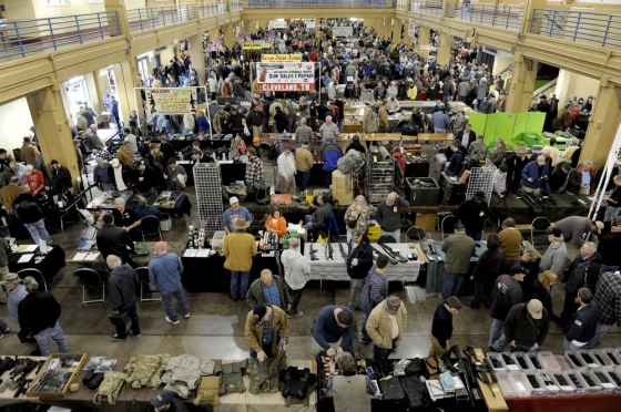 People crowd pack a gun show in Knoxville, Tenn., on Dec. 28.