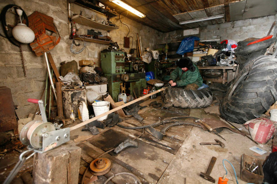 Yushkov modifies a truck tire for use on his self-made three-wheeled cross-country vehicle, on March 11, 2013.