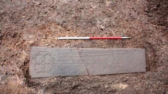 This carved slab, thought to be the headstone of a medieval knight, was found under a parking lot in Edinburgh.