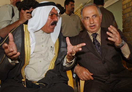 Iraqi opposition leader Ahmad Chalabi, right, talks to tribal leader Ali-Farhan Al-Temimi in Baghdad on April 18, 2003.