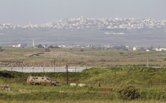 An Israeli armored vehicle is seen on the Israeli-Syrian border in the Israeli-occupied Golan Heights on Sunday.