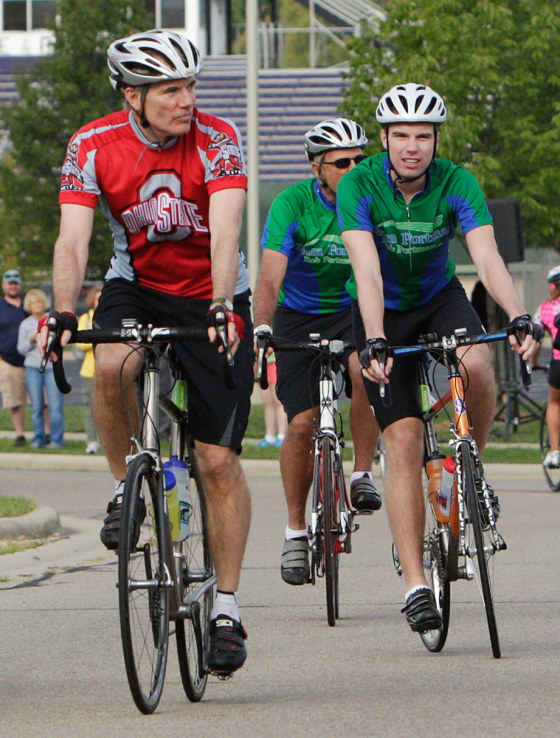 Sen. Rob Portman, R-Ohio, wearing the red jersey, riding in Columbus with his son Will in August 2012. Rob Portman said his views on gay marriage began changing in 2011 when Will, then a freshman at Yale University, told his parents he was gay.