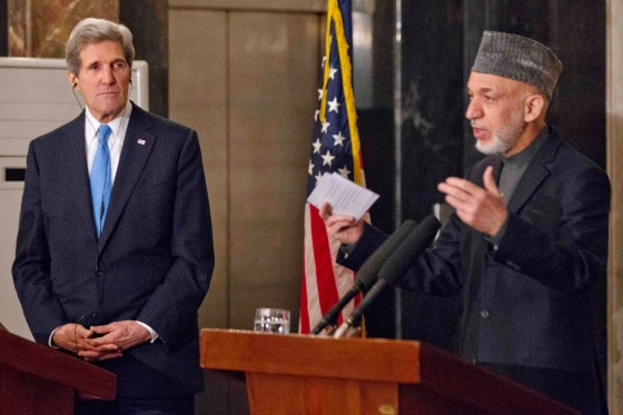 U.S. Secretary of State John Kerry, left, listens to Afghanistan's President Hamid Karzai during their joint news conference at the presidential palace in Kabul on Thursday, March 25, 2013.