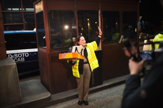 Marilyn Alvardo waves as she leaves her tollbooth, as the last human toll collector, early on Wednesday.