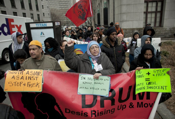 People participate in a demonstration against the city's stop-and-frisk searches in lower Manhattan near federal court on March 18, 2013 in New York City, the day hearings began.