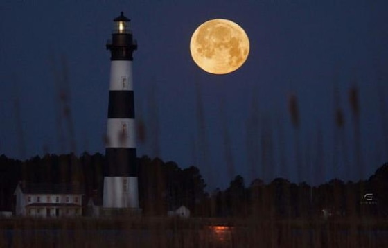 The 2013 March full moon hangs bright over the Bodie Island Lighthouse in Outer Banks, N.C., in this photo from Greg Diesel Walck.