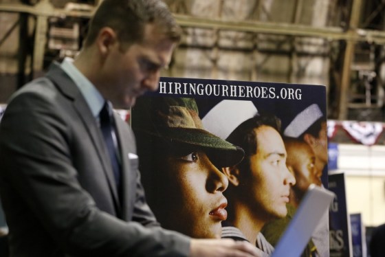 An attendee searches for a job listing during the 'Hiring Our Heroes' job fair in New York, March 27, 2013.