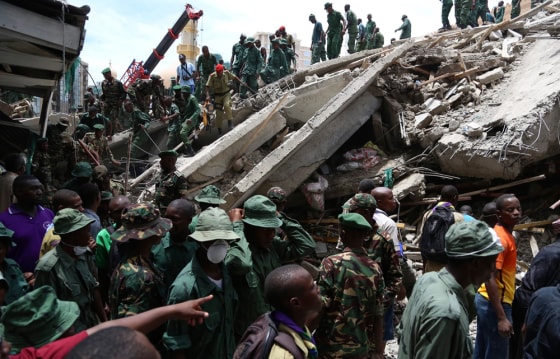 Rescuers search for survivors in the rubble of a collapsed building in the Kariakoo district of central Dar es Salaam, Tanzania on Friday.