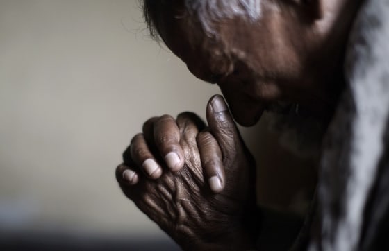 An elderly Pakistani Christian man, prays during a Mass on Good Friday in a church in Islamabad, Pakistan, Friday, March 29, 2013. Christians around the world are marking the Easter holy week.