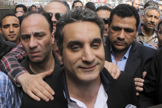 A bodyguard protects popular Egyptian television satirist Bassem Youssef, who has come to be known as Egypt's Jon Stewart.