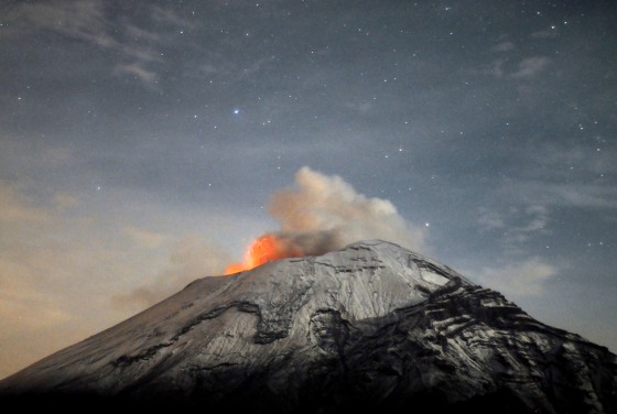 Mexico's Popocatepetl volcano spews ash into a starry night