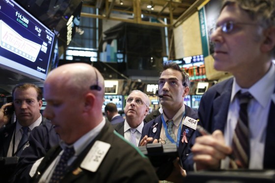 Traders work on the floor at the New York Stock Exchange May 30, 2013.