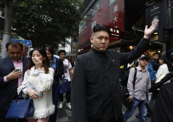 Australian impersonator Howard, who will not reveal his last name, poses for the media in Hong Kong on Wednesday.