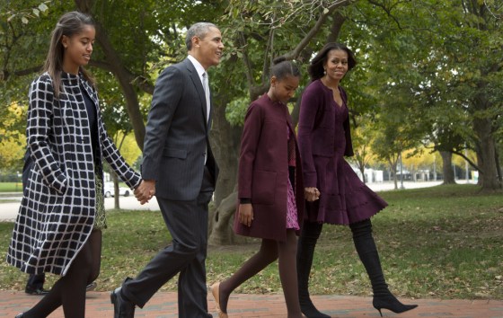 President Barack Obama with first lady Michelle Obama, and their daughters Malia, left, and Sasha, walk on Lafayette Park across the White House in Washington to attend a church service Sunday, Oct. 27, 2013.