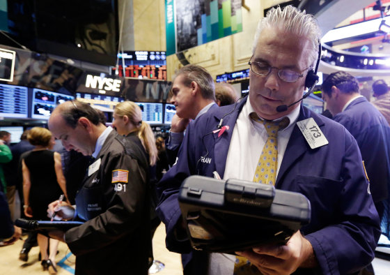 Trader Frank O'Connell works on the floor of the New York Stock Exchange on Wednesday.