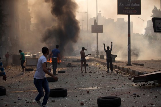 Supporters and opponents of Egypt's ousted Islamist President Mohamed Morsi clash in Cairo, Egypt, Sunday, Oct. 6, 2013.