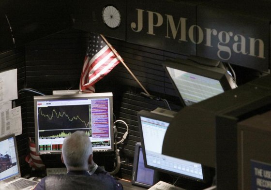 A trader works in the J.P. Morgan stall on the floor of the New York Stock Exchange in this Sept. 14, 2009, file photo.