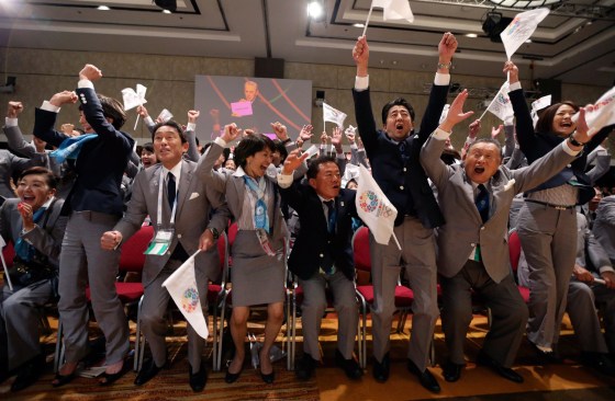 Prime Minister Shinzo Abe of Japan, third from right, celebrates with members of the Tokyo bid committee as Jacques Rogge, President of the International Olympic Committee (IOC), announces Tokyo as the city to host the 2020 Summer Olympic Game during a ceremony in Buenos Aires, Sept. 7.