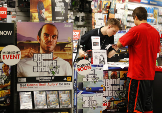 Game enthusiasts purchase the latest release of 'Grand Theft Auto V' at the Game Stop store in Encinitas, California in this file photo taken Septembe...