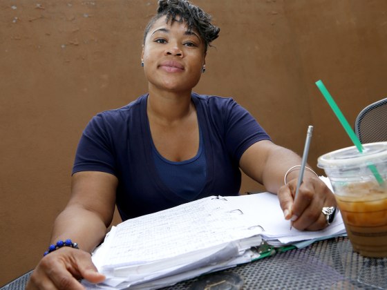 Helena Gudger, 26, pauses as she works on homework while taking a break between classes at her college in Phoenix. She wants to sign up for private health insurance as soon as the new federal marketplace opens Tuesday.