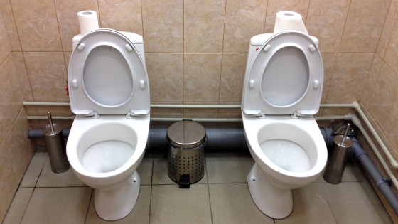 In this photo taken Saturday, Feb. 1, 2014, two female toilets sit side-by-side at the security screening facility outside the Main Press Center at the 2014 Winter Olympics, in Sochi, Russia.