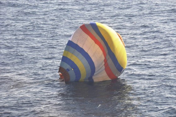A hot-air balloon drifts on the East China Sea near the disputed isles known as Senkaku in Japan and Diaoyu in China, in a photo released by Japan's Coast Guard.