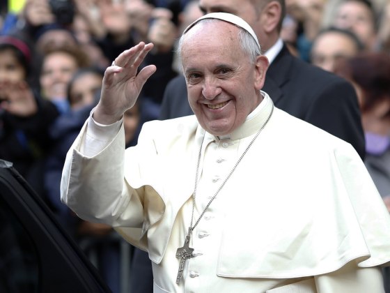 Pope Francis waves as he leaves at the end of his mass at the Church of the Most Holy Name of Jesus in downtown Rome Jan. 3, 2014.