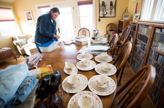 VeraMae Volk and her husband Eric Vaughn use their dining room table as an ebay center.