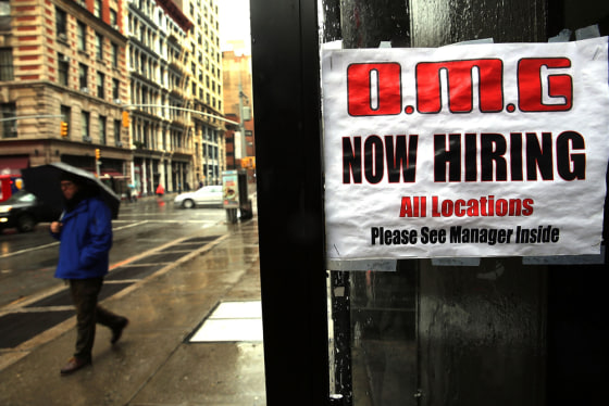 A sign in a window at a retail store advertises for a job opening on Dec. 6, 2013, in New York City.