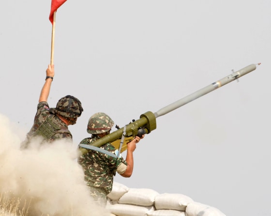 Macedonian soldiers fire a Russian-made IGLA ground-to-air missile during a live fire exercise in 2008.