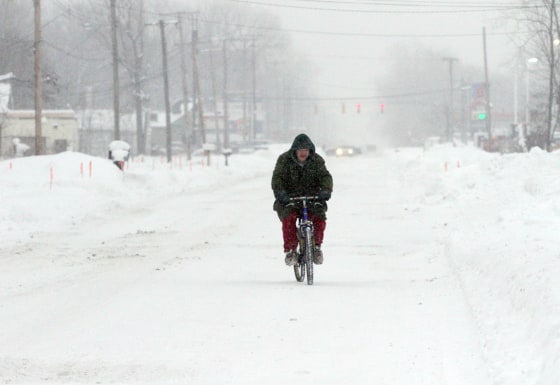 Lonnie Bates rides his bike in Gary, Indiana on Wednesday.