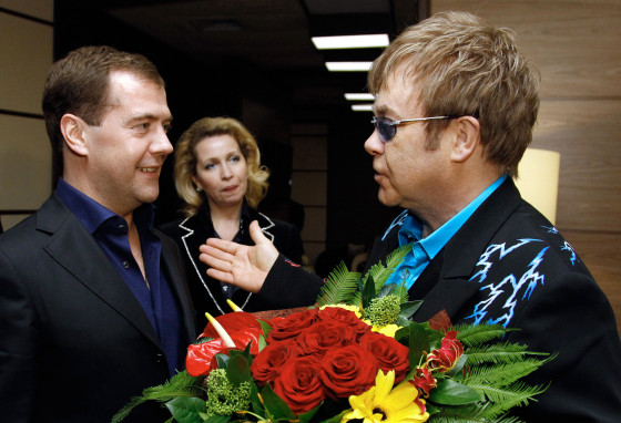 Then-Russian President Dmitry Medvedev, left, meets Elton John after his concert in Moscow in December 2010.