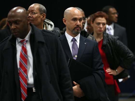 WASHINGTON, DC - JANUARY 10: People wait in line at the Dept. of Veterans Affairs booth during the Hiring Our Heroes job fair at the Washington Conven...