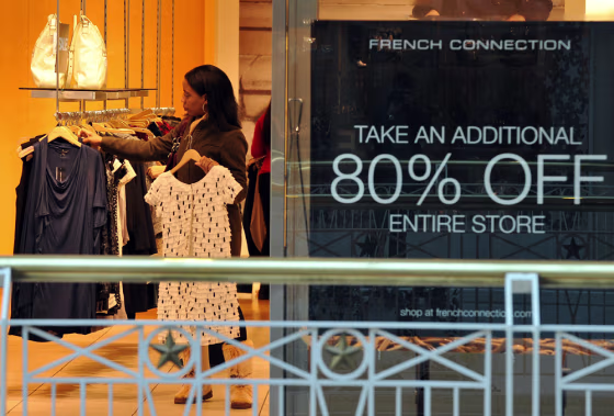 Image: A woman shops at a store in a mall in Wa