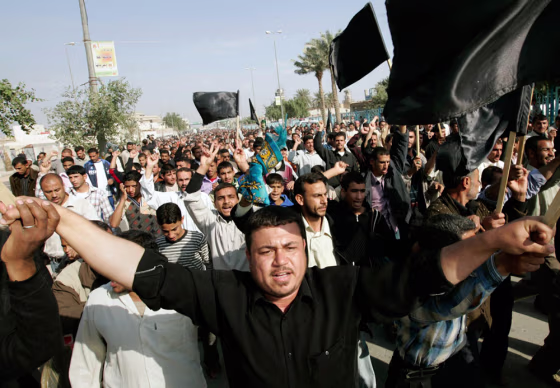 Image: Followers of Moqtada al-Sadr march during a rally in Kufa