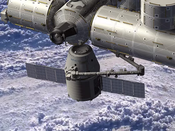 An artist's conception shows SpaceX's Dragon capsule delivering cargo to the International Space Station.