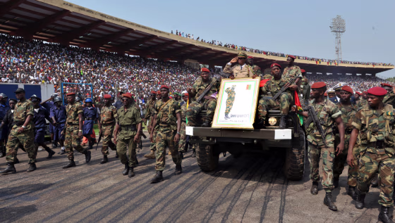 Image: Guinean soldiers escort the remains of late dictator Lansana Conte