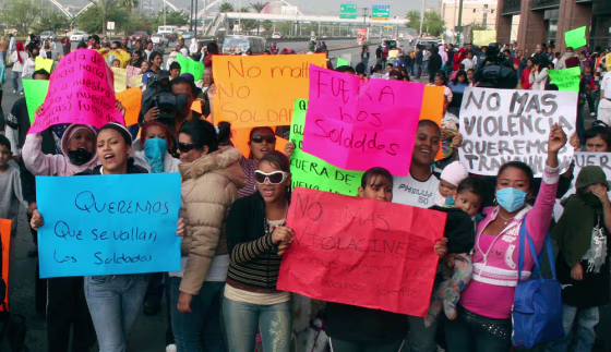 Image: Protesters block a main avenue during a demonstration against the Mexican army in Monterrey