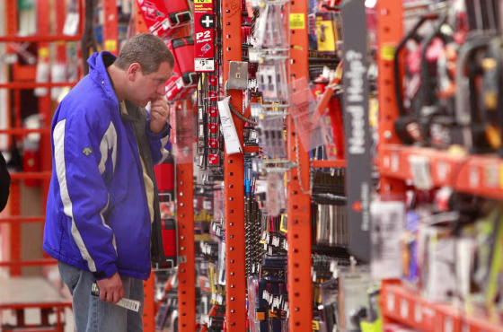 Image: customer looks at the tool selection at a Home Depot